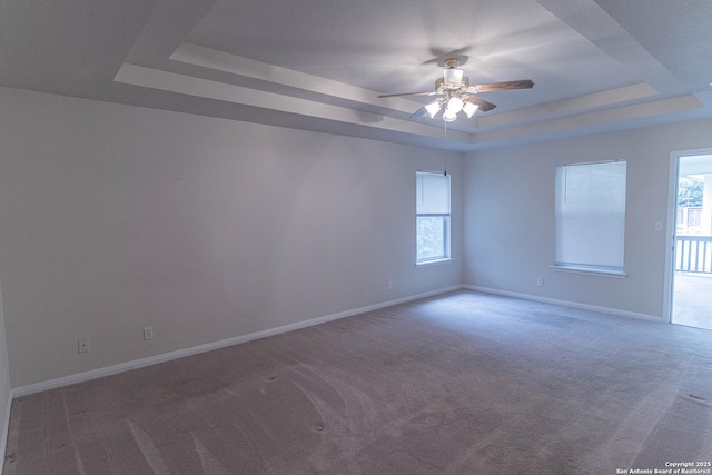 424 Mount Joy, New Braunfels, TX 78130 - carpeted empty room with a raised ceiling, ceiling fan, and baseboards