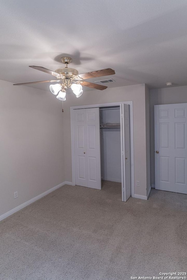 424 Mount Joy, New Braunfels, TX 78130 - unfurnished bedroom featuring light carpet, baseboards, a closet, and ceiling fan