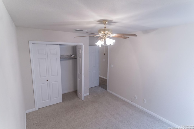 424 Mount Joy, New Braunfels, TX 78130 - unfurnished bedroom featuring light carpet, a closet, a ceiling fan, and baseboards