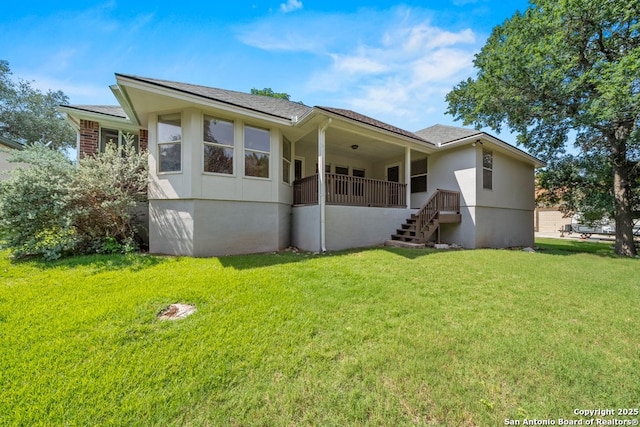 424 Mount Joy, New Braunfels, TX 78130 - back of house featuring a lawn, stairway, stucco siding, and a shingled roof