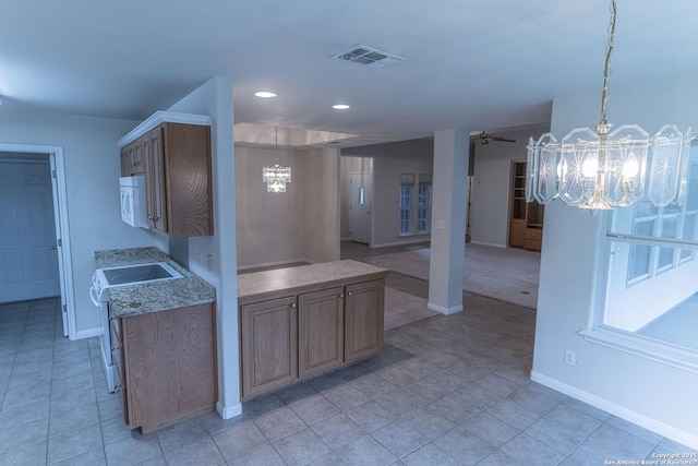 424 Mount Joy, New Braunfels, TX 78130 - kitchen with a chandelier, white appliances, baseboards, light tile patterned floors, and recessed lighting