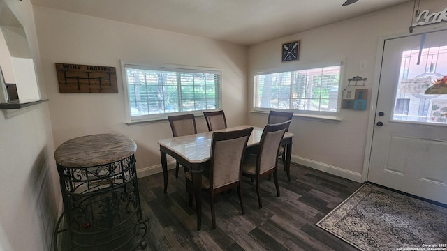 12151 Park Road 37, Lakehills, TX 78063 - dining room featuring dark wood-style flooring and baseboards
