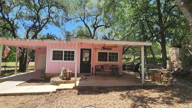 12151 Park Road 37, Lakehills, TX 78063 - back of property featuring ceiling fan, a carport, and driveway