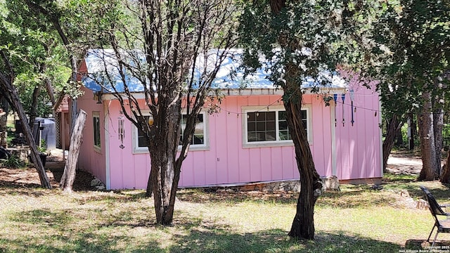 12151 Park Road 37, Lakehills, TX 78063 - view of property exterior with a lawn and an outbuilding