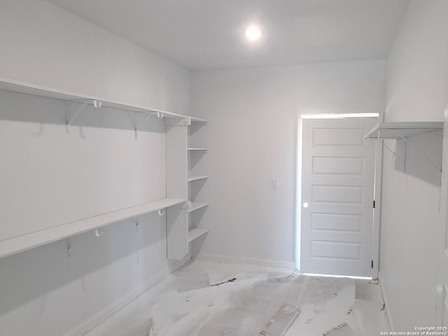 52 Peach Tree, Poteet, TX 78065 - spacious closet featuring marble finish floors
