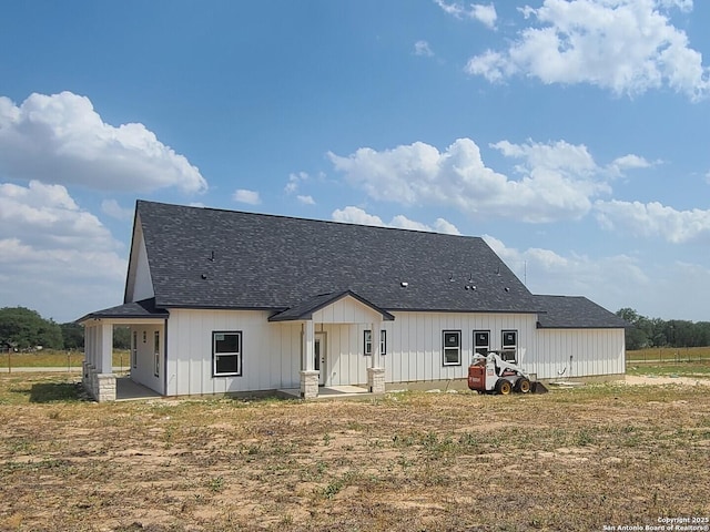 52 Peach Tree, Poteet, TX 78065 - back of property with a patio, roof with shingles, and board and batten siding