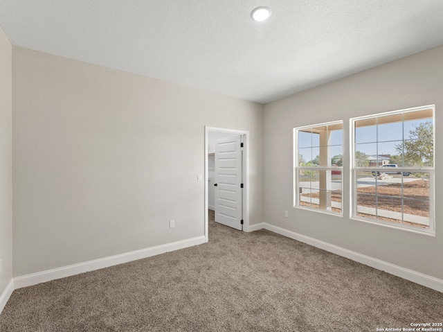 52 Peach Tree, Poteet, TX 78065 - unfurnished room with carpet flooring and baseboards