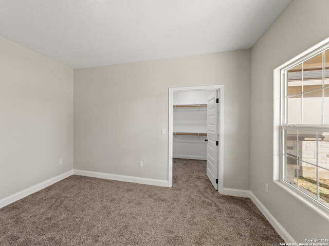 52 Peach Tree, Poteet, TX 78065 - spare room featuring carpet floors and baseboards