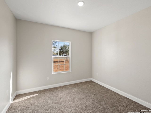52 Peach Tree, Poteet, TX 78065 - carpeted empty room with baseboards