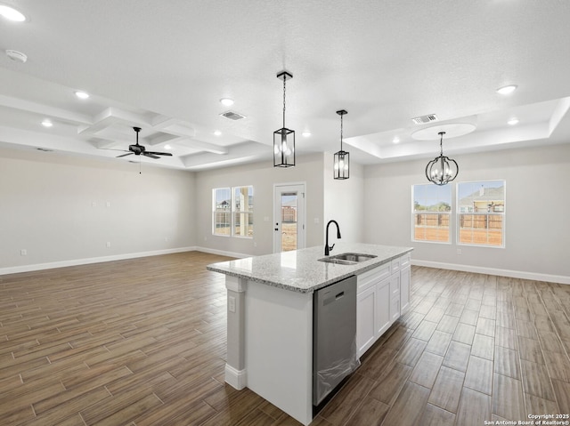 52 Peach Tree, Poteet, TX 78065 - kitchen with dishwasher, a sink, a raised ceiling, wood finished floors, and recessed lighting