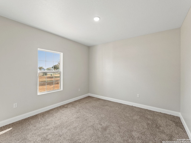 52 Peach Tree, Poteet, TX 78065 - carpeted spare room with baseboards and recessed lighting