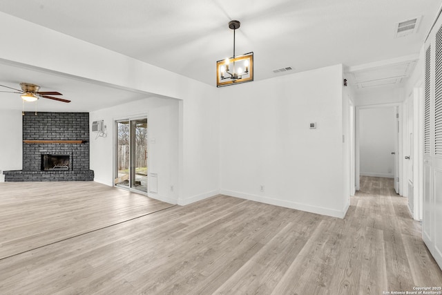 4419 El Simpatico, San Antonio, TX 78233 - unfurnished living room featuring light wood-type flooring, a brick fireplace, ceiling fan, and baseboards