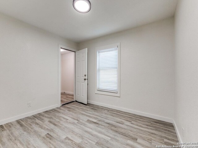 815 Flanders, San Antonio, TX 78211 - spare room with wood finished floors and baseboards