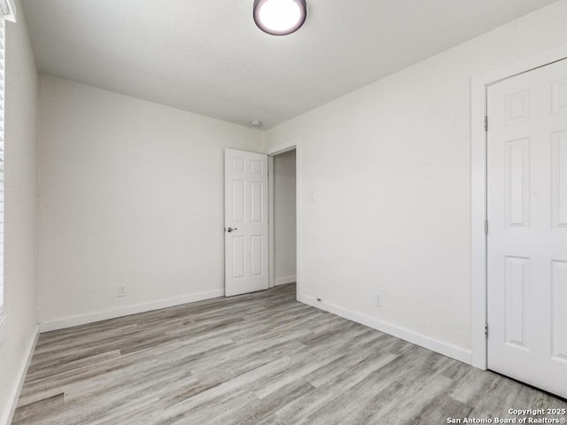 815 Flanders, San Antonio, TX 78211 - spare room featuring light wood-style flooring and baseboards