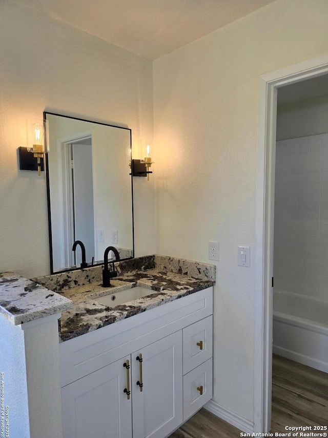7401 Old Spanish Trl, Live Oak, TX 78233 - bathroom with vanity, wood finished floors, and baseboards