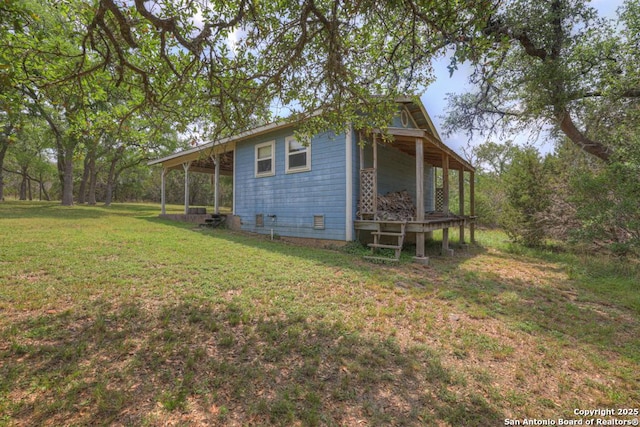 163 Eden Rnch, Canyon Lake, TX 78133 - view of side of home with a yard and covered porch