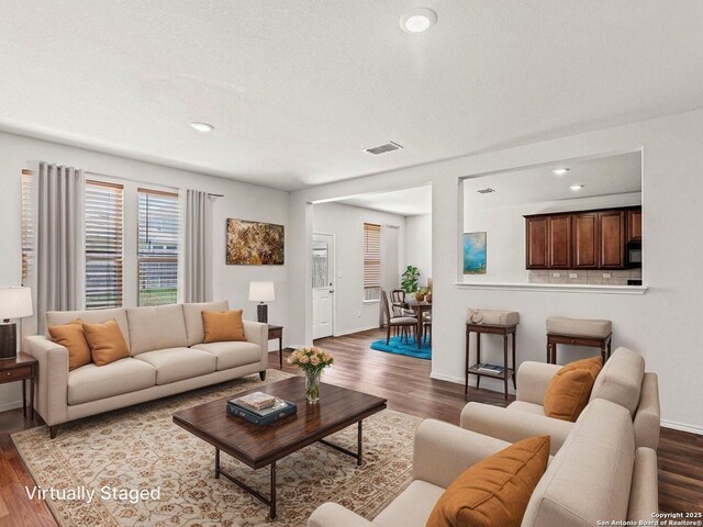 3175 Wild Indigo, New Braunfels, TX 78130 - living room with dark wood finished floors, baseboards, and recessed lighting