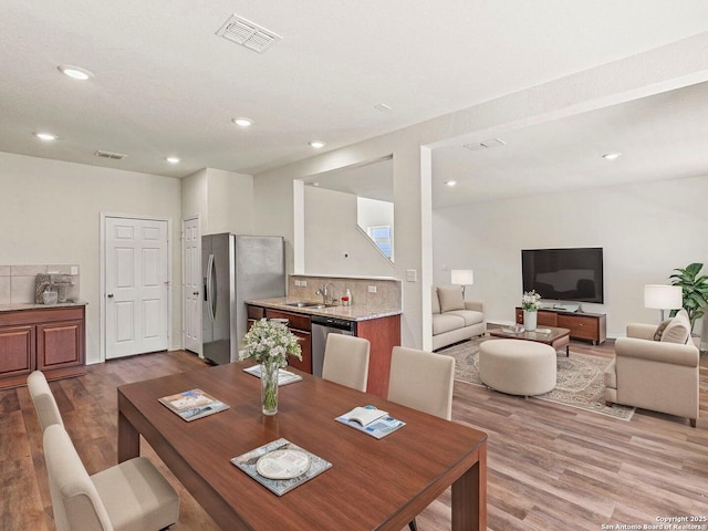3175 Wild Indigo, New Braunfels, TX 78130 - dining area with wood finished floors and recessed lighting