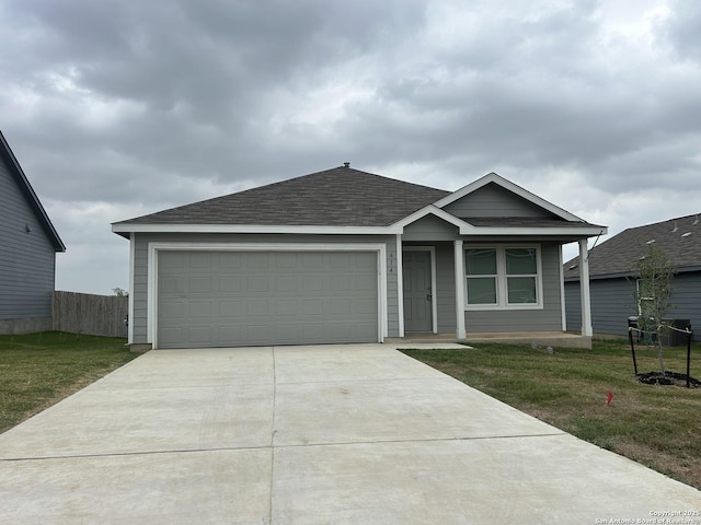 614 Agave, Jourdanton, TX 78026 - ranch-style house featuring driveway, a shingled roof, an attached garage, and covered porch