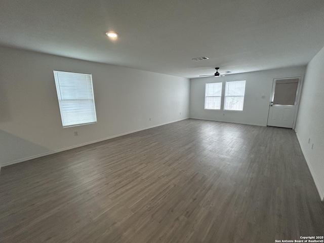 614 Agave, Jourdanton, TX 78026 - empty room featuring a ceiling fan, dark wood-style floors, baseboards, and recessed lighting