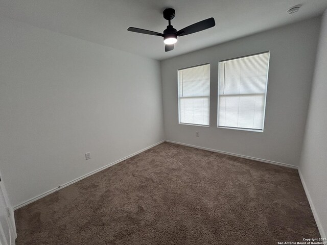 614 Agave, Jourdanton, TX 78026 - carpeted spare room featuring a ceiling fan, baseboards, and a smoke detector
