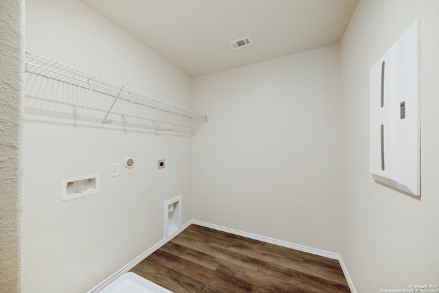 7341 Yucca Pl, San Antonio, TX 78253 - laundry area with hookup for an electric dryer, dark wood finished floors, hookup for a washing machine, and baseboards