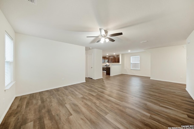 7341 Yucca Pl, San Antonio, TX 78253 - unfurnished living room featuring a ceiling fan, wood finished floors, baseboards, and recessed lighting
