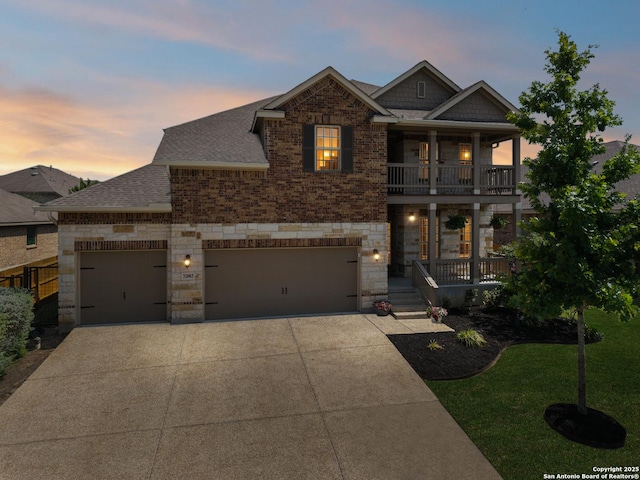 32003 Cast Iron, Bulverde, TX 78163 - view of front of property featuring stone siding, a balcony, a porch, a shingled roof, and driveway