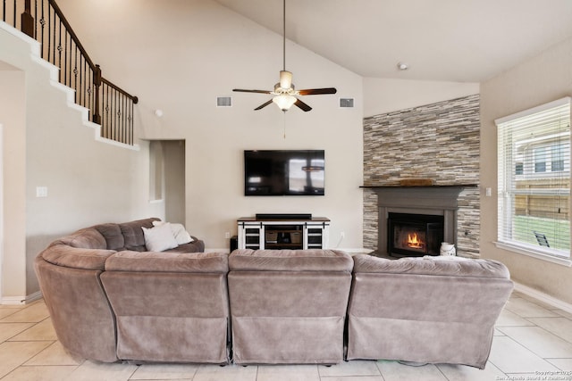 32003 Cast Iron, Bulverde, TX 78163 - living area with ceiling fan, high vaulted ceiling, light tile patterned floors, a glass covered fireplace, and baseboards