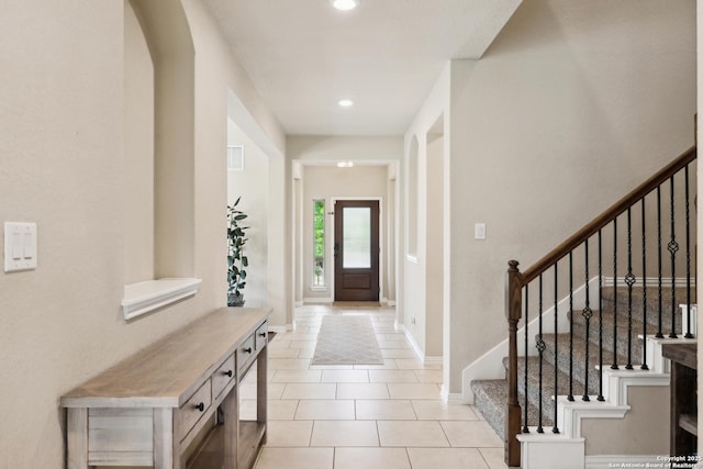 32003 Cast Iron, Bulverde, TX 78163 - entryway featuring light tile patterned flooring, stairway, baseboards, recessed lighting, and arched walkways