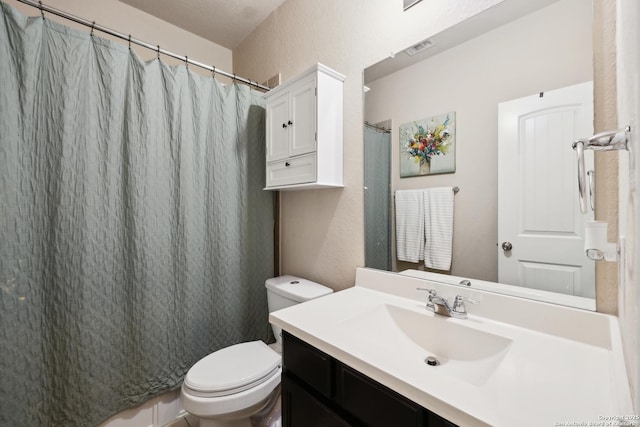 32003 Cast Iron, Bulverde, TX 78163 - bathroom featuring vanity, toilet, a textured wall, and curtained shower