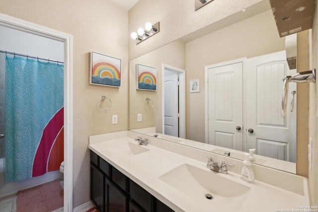 32003 Cast Iron, Bulverde, TX 78163 - bathroom featuring double vanity, toilet, and shower / tub combo