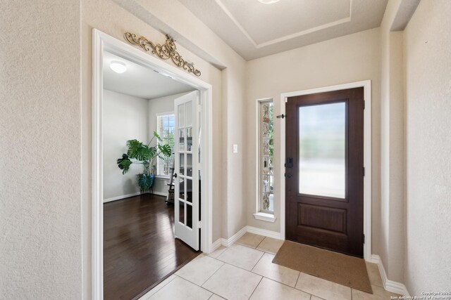 32003 Cast Iron, Bulverde, TX 78163 - foyer entrance featuring a textured wall, baseboards, and light tile patterned flooring