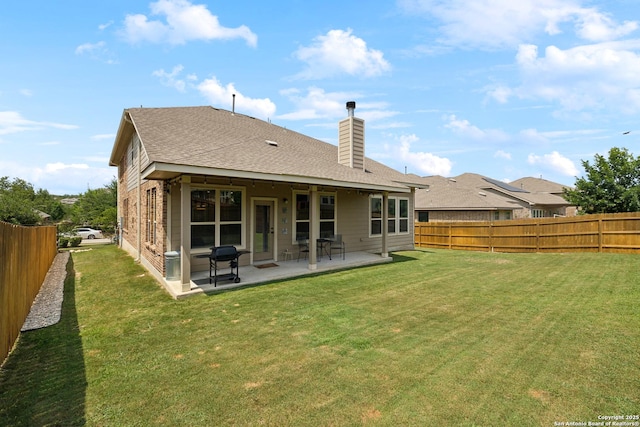32003 Cast Iron, Bulverde, TX 78163 - back of property with a chimney, a patio area, and a shingled roof
