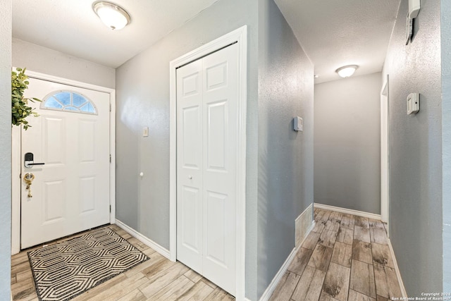 5802 Branch Vly, San Antonio, TX 78242 - foyer entrance featuring wood finished floors, baseboards, and a textured wall