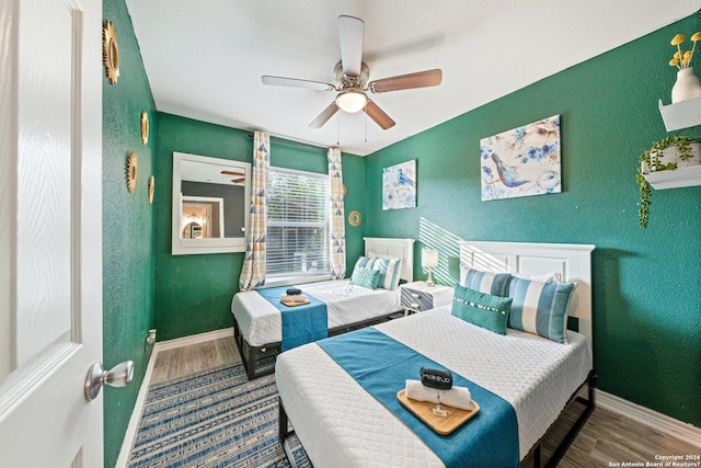 5802 Branch Vly, San Antonio, TX 78242 - bedroom with wood finished floors, baseboards, a textured wall, and a ceiling fan