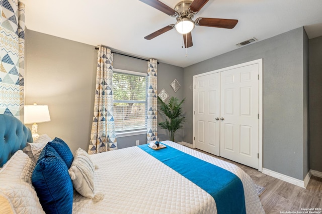 5802 Branch Vly, San Antonio, TX 78242 - bedroom with wood finished floors, a closet, baseboards, and ceiling fan