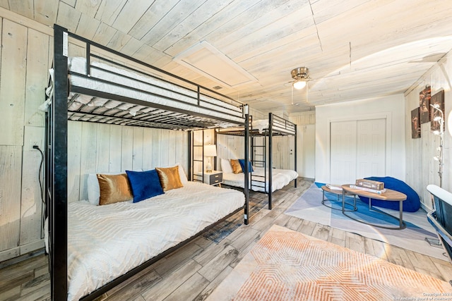 5802 Branch Vly, San Antonio, TX 78242 - bedroom with wood-type flooring, wood walls, a closet, and wooden ceiling