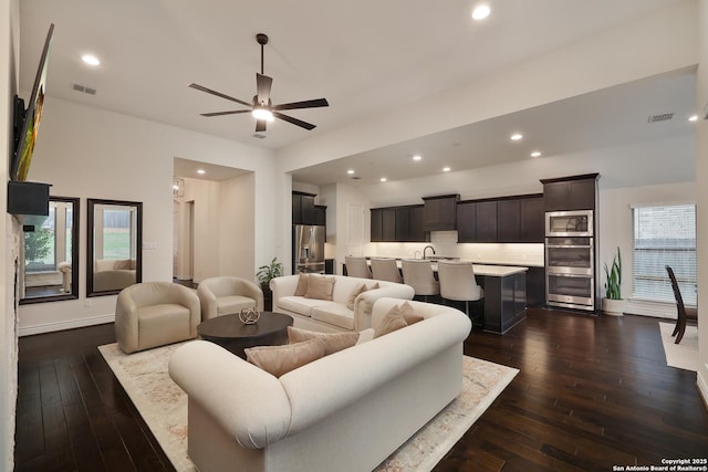 24321 Downhill Lie, San Antonio, TX 78261 - living room with dark wood-style flooring, ceiling fan, recessed lighting, and baseboards