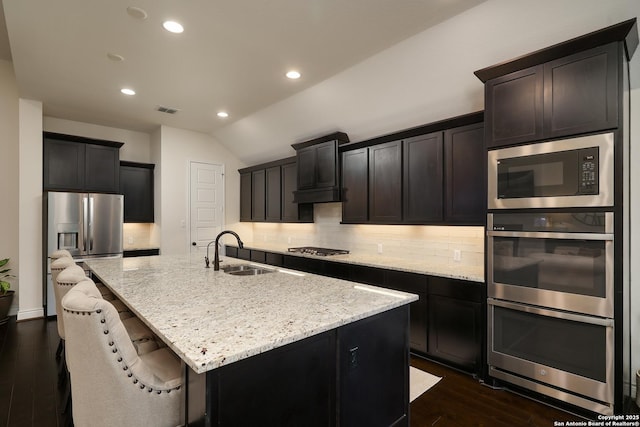 24321 Downhill Lie, San Antonio, TX 78261 - kitchen with a sink, appliances with stainless steel finishes, light stone countertops, tasteful backsplash, and recessed lighting