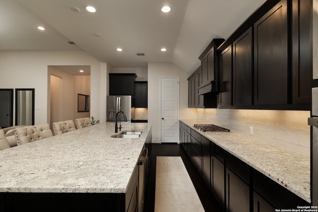 24321 Downhill Lie, San Antonio, TX 78261 - kitchen with a sink, stainless steel appliances, recessed lighting, backsplash, and light stone counters