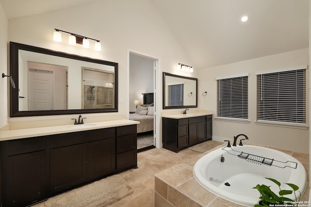 24321 Downhill Lie, San Antonio, TX 78261 - full bathroom featuring two vanities, a garden tub, high vaulted ceiling, and a shower