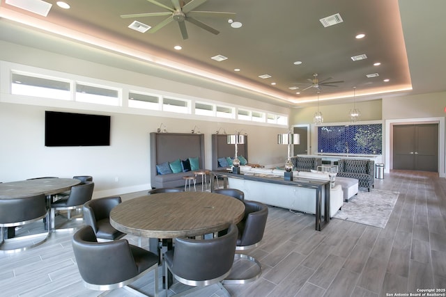 24321 Downhill Lie, San Antonio, TX 78261 - living area with ceiling fan, a tray ceiling, light wood-style floors, recessed lighting, and baseboards