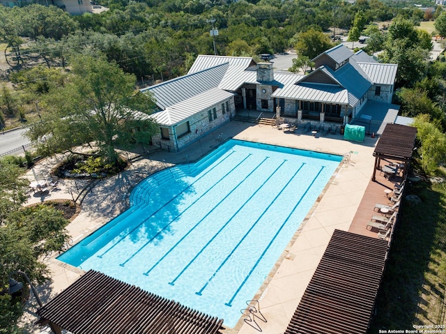 24321 Downhill Lie, San Antonio, TX 78261 - community pool with a patio area and a forest view