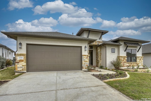 23350 Grande Vis, San Antonio, TX 78261 - prairie-style home with stone siding, driveway, stucco siding, and a garage