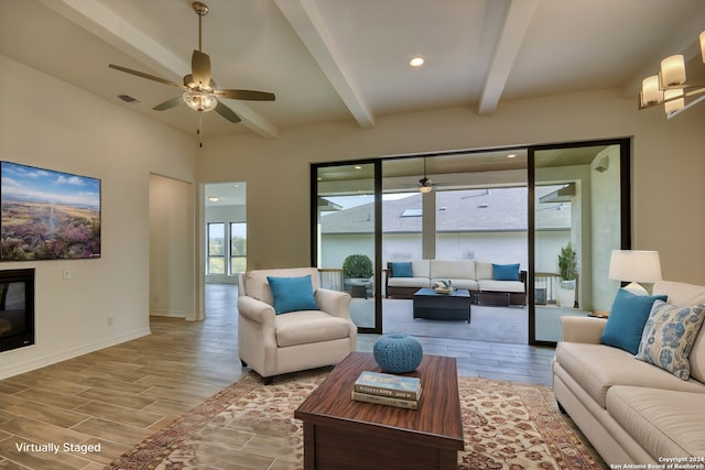 23350 Grande Vis, San Antonio, TX 78261 - living room featuring ceiling fan, beamed ceiling, light wood finished floors, and baseboards