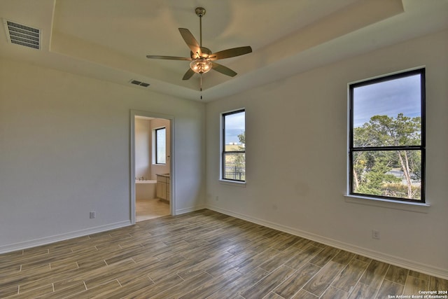 23350 Grande Vis, San Antonio, TX 78261 - spare room featuring a raised ceiling, wood finished floors, ceiling fan, and baseboards