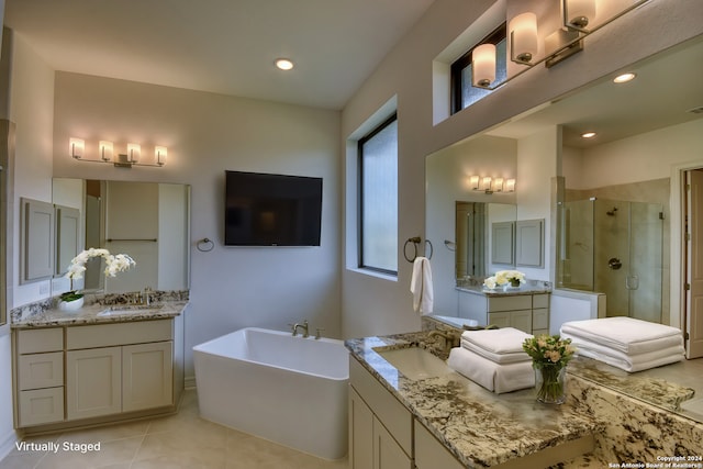 23350 Grande Vis, San Antonio, TX 78261 - full bath with a stall shower, two vanities, a freestanding tub, tile patterned floors, and recessed lighting