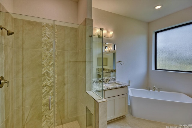23350 Grande Vis, San Antonio, TX 78261 - bathroom featuring a shower stall, a freestanding tub, vanity, and tile patterned flooring