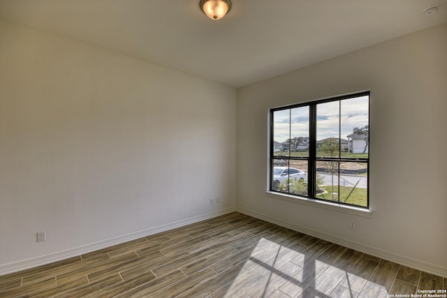 23350 Grande Vis, San Antonio, TX 78261 - empty room with wood finish floors, baseboards, and a smoke detector